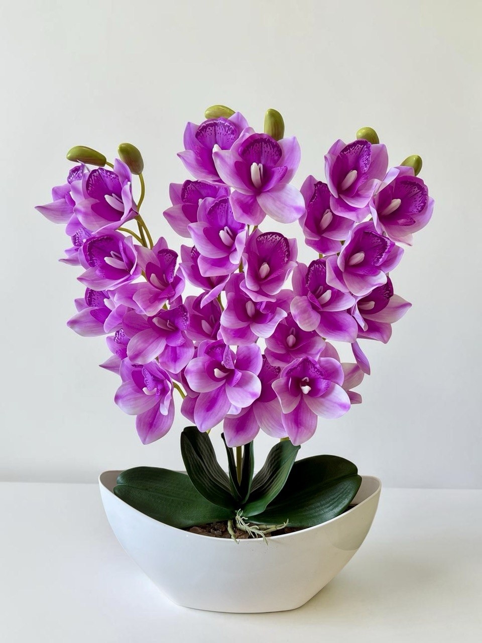 Орхідея штучна Цимбідіум в вазоні рожевого кольору три гілки