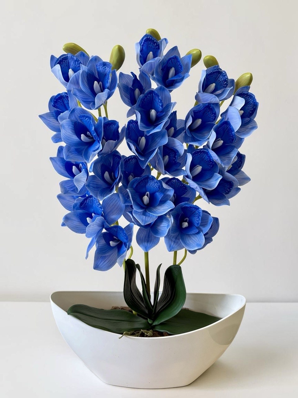 Орхідея штучна Цимбідіум в вазоні синього кольору три гілки