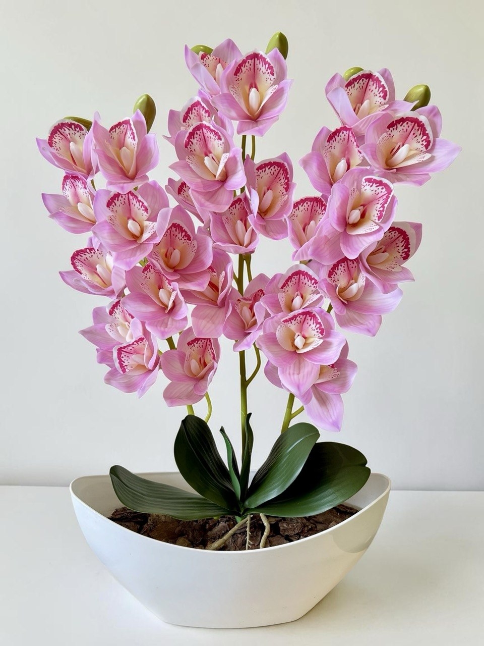 Орхідея штучна Цимбідіум в вазоні світло-рожевого кольору три гілки