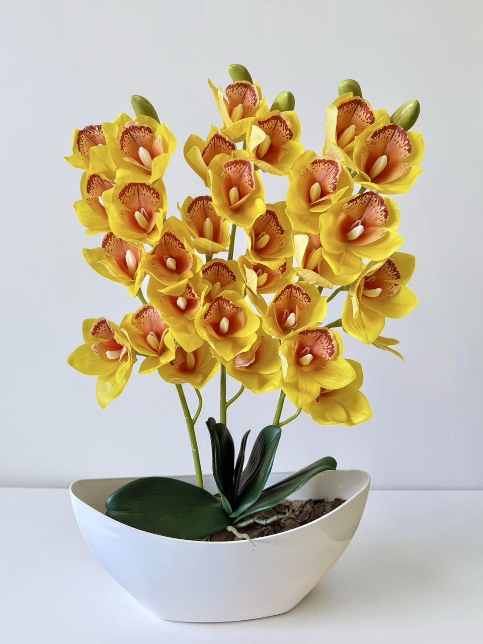 Орхідея штучна Цимбідіум в вазоні жовтого кольору три гілки