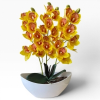 Artificial orchid Cymbidium in a vase - a realistic decorative composition for the interior