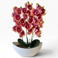 Artificial orchid Cymbidium in a vase - a realistic decorative composition for the interior