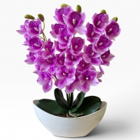 Artificial orchid Cymbidium in a vase - a realistic decorative composition for the interior