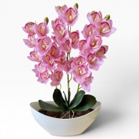 Artificial orchid Cymbidium in a vase - a realistic decorative composition for the interior