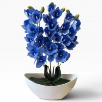 Artificial orchid Cymbidium in a vase - a realistic decorative composition for the interior