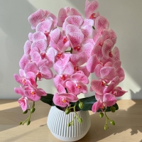 Artificial orchid on 3 branches in a round pot with latex flowers